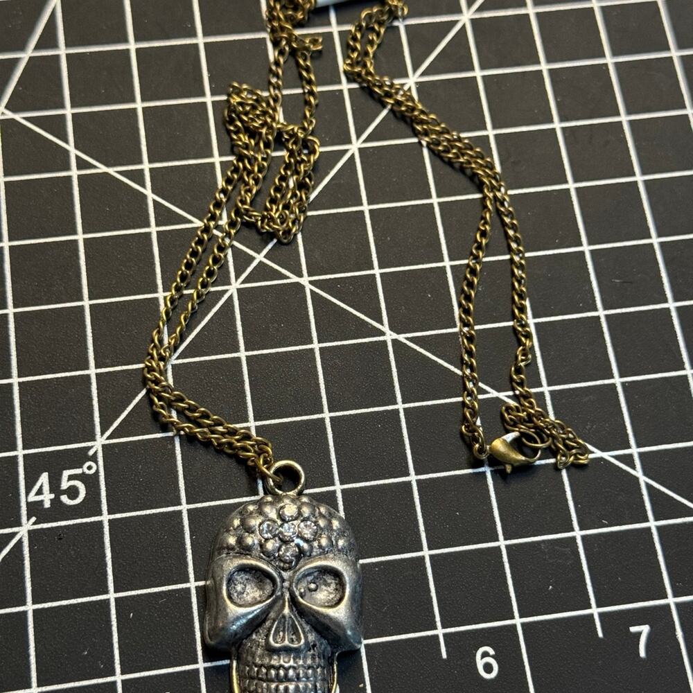 Silver tone skull with rhinestones on gold chain goth emo punk